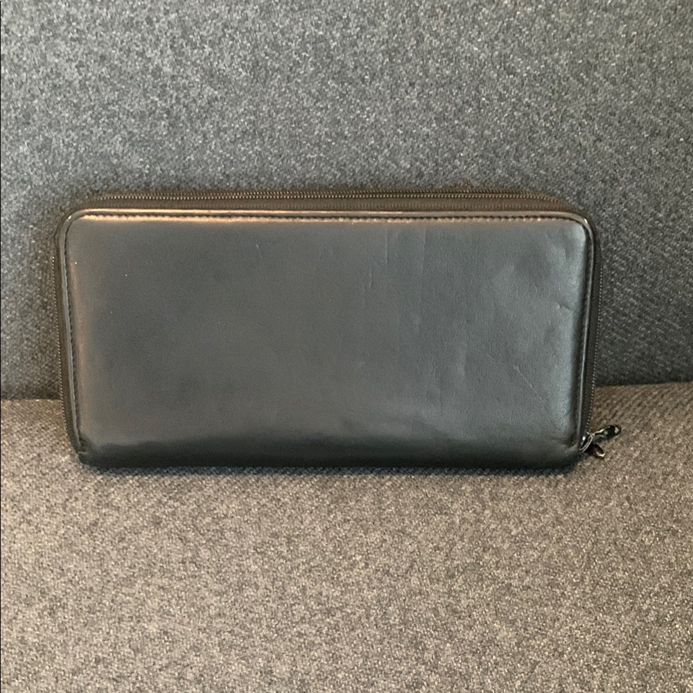 Tumi - Black Leather Continental Wallet with Zip-Around Closure